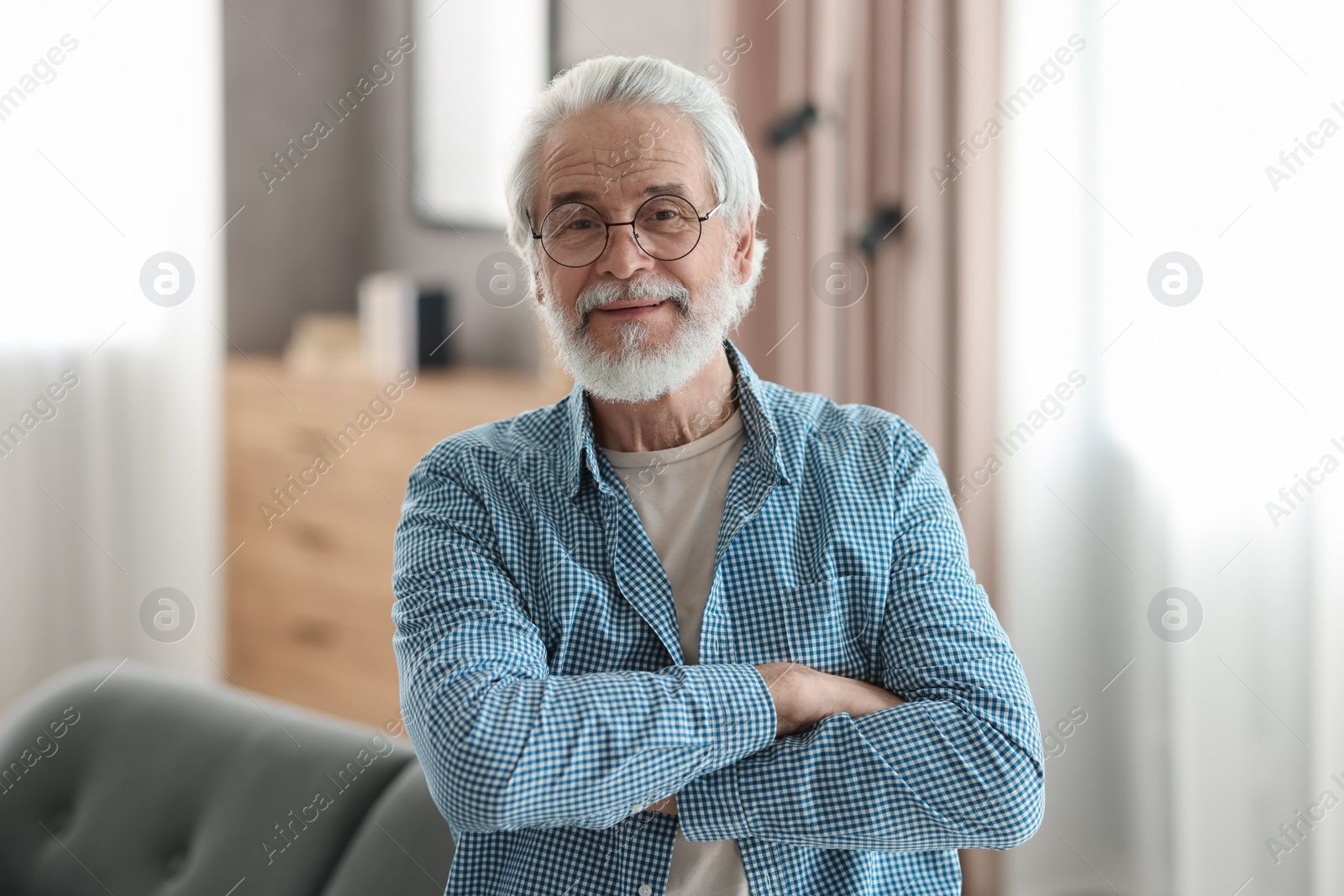 Photo of Portrait of happy grandpa with glasses indoors