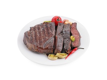 Photo of Delicious grilled beef meat with vegetables isolated on white