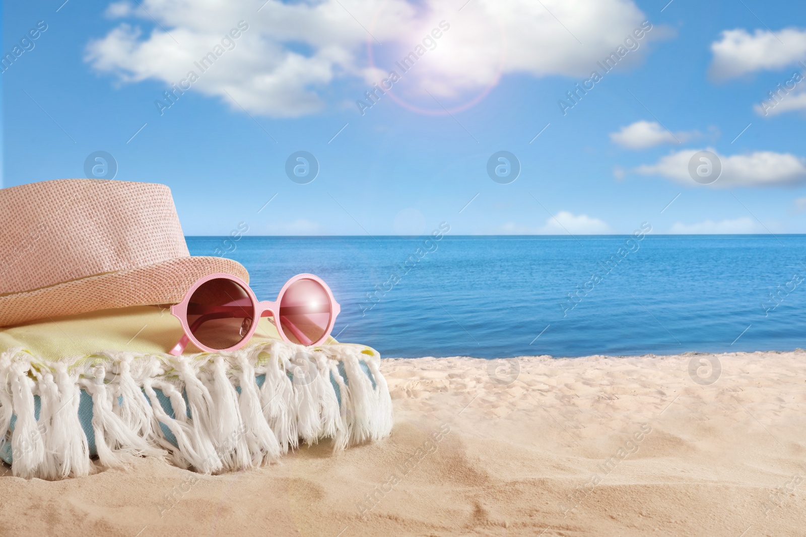 Image of Beach objects on sand near sea, space for text. Summer vacation 