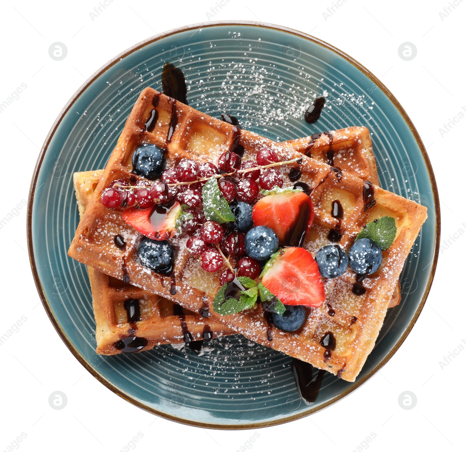 Photo of Delicious Belgian waffles with berries on white background, top view