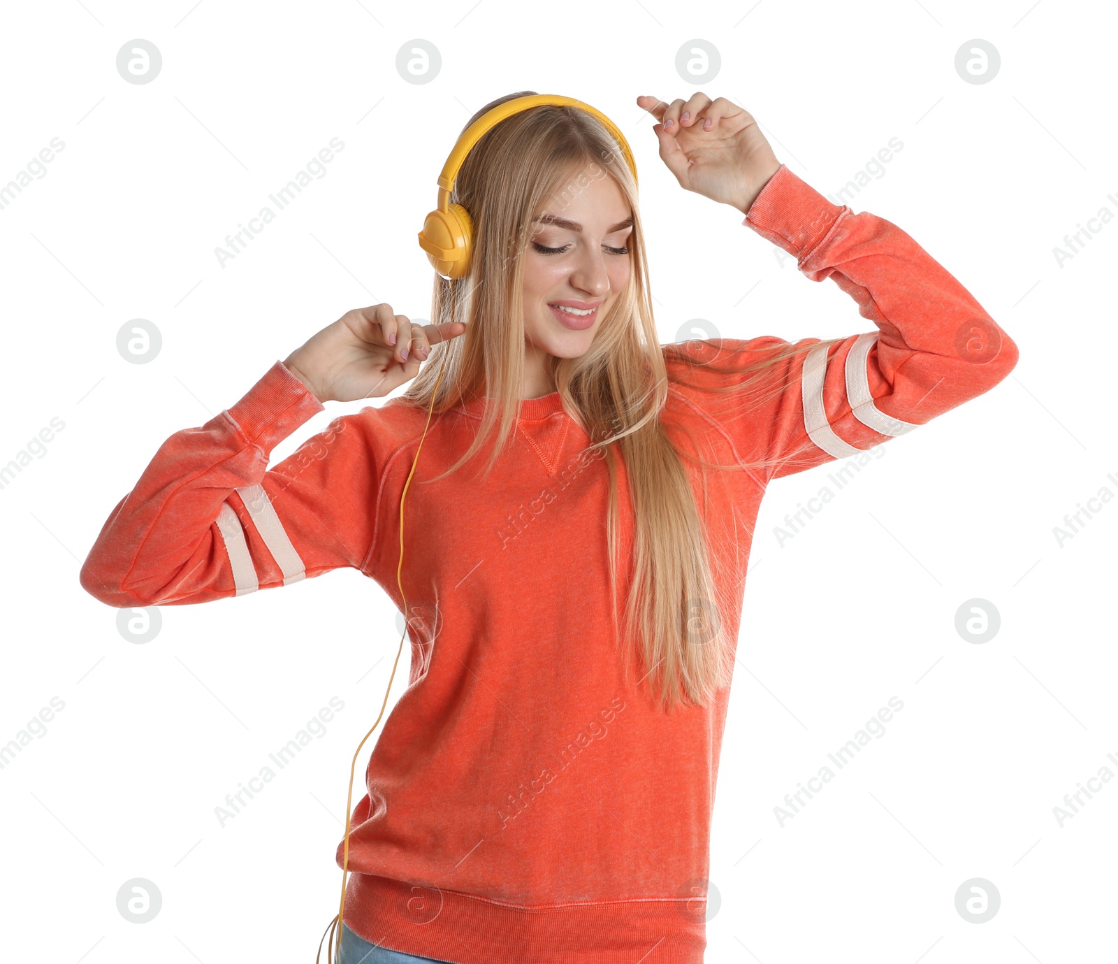 Photo of Beautiful young woman listening to music with headphones on white background