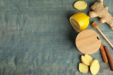 Flat lay composition with cold remedies on blue wooden table, space for text. Sore throat treatment