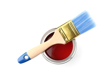 Paint can with brush on white background, top view