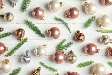 Flat lay composition with Christmas decor on white wooden background