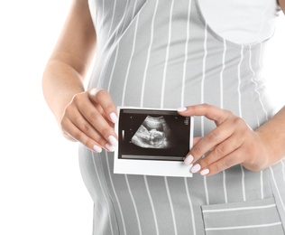 Photo of Pregnant woman with ultrasound picture on white background, closeup