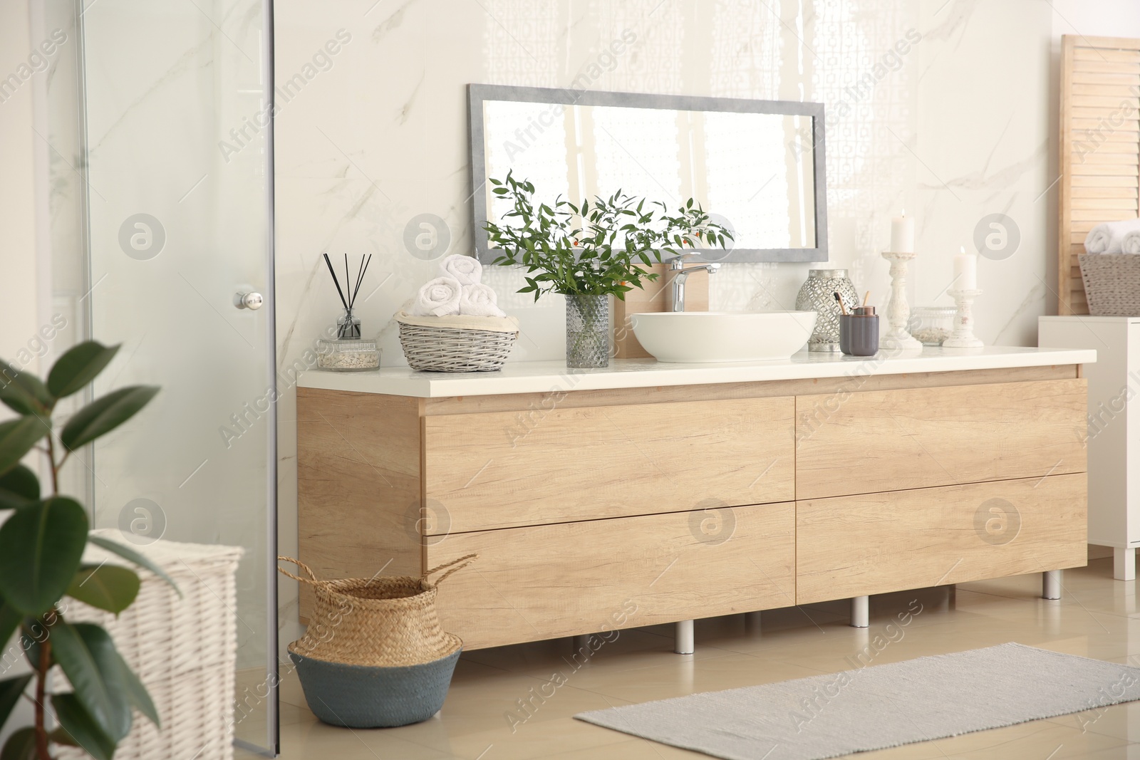 Photo of Modern bathroom interior with stylish mirror and vessel sink