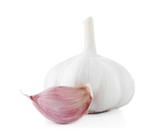 Photo of Fresh garlic bulb and clove on white background. Organic food