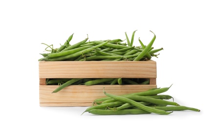 Photo of Fresh green beans in wooden crate on white background