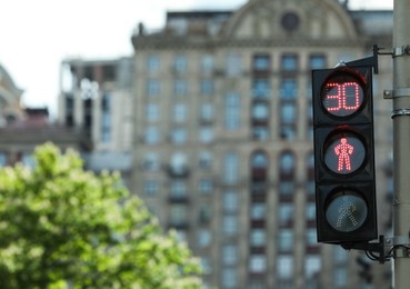 View of traffic light in city on sunny day. Space for text