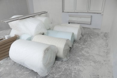 Polyethylene foam rolls in room prepared for renovation