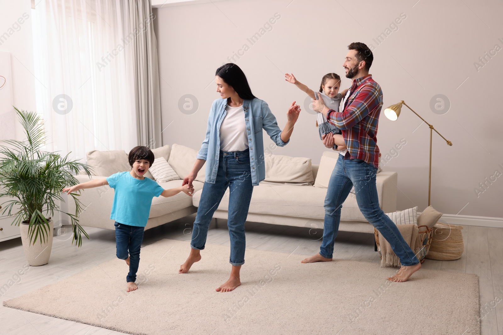 Photo of Happy family spending time together at home