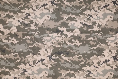 Texture of camouflage fabric as background, top view