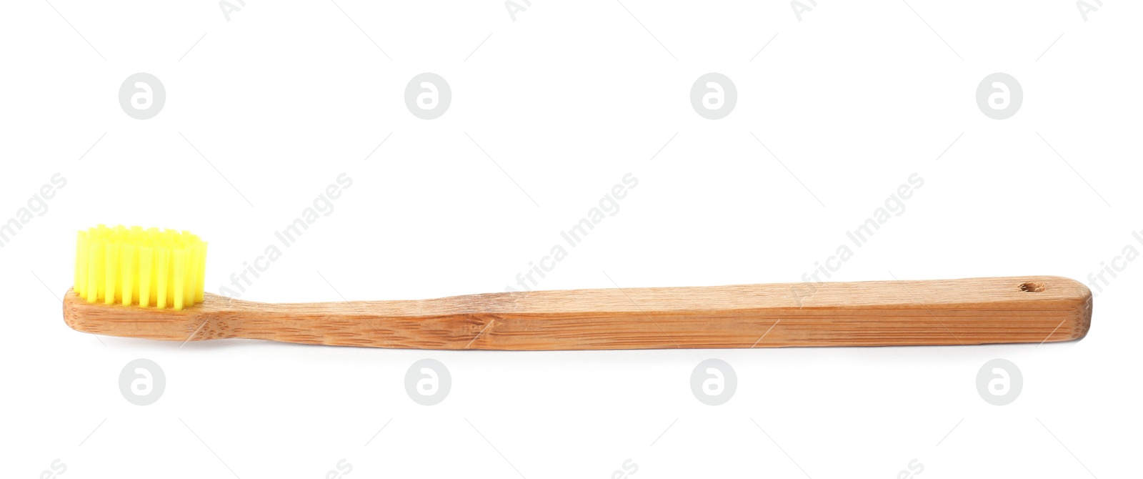 Photo of Bamboo toothbrush on white background. Dental care