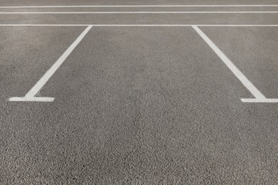 Outdoor car parking lot with white marking lines 