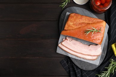 Photo of Flat lay composition with delicious smoked bacon on wooden table, space for text