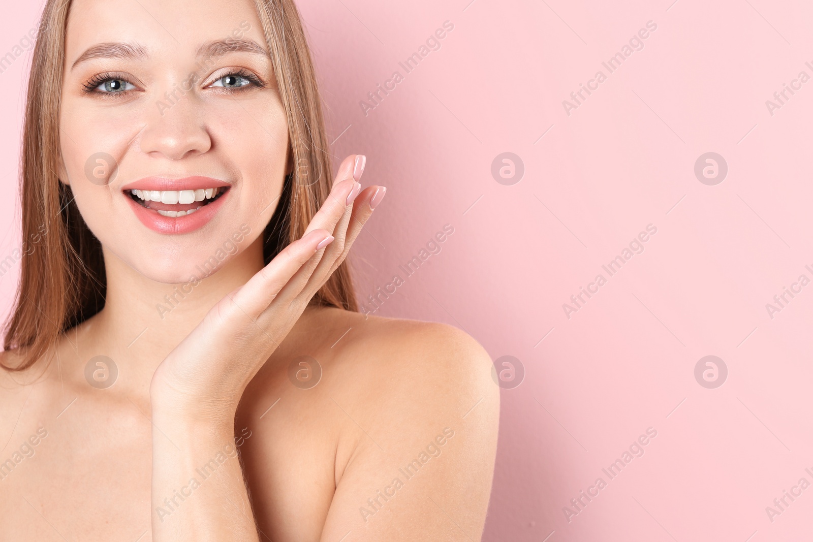 Photo of Portrait of beautiful young woman with natural makeup on color background. Space for text