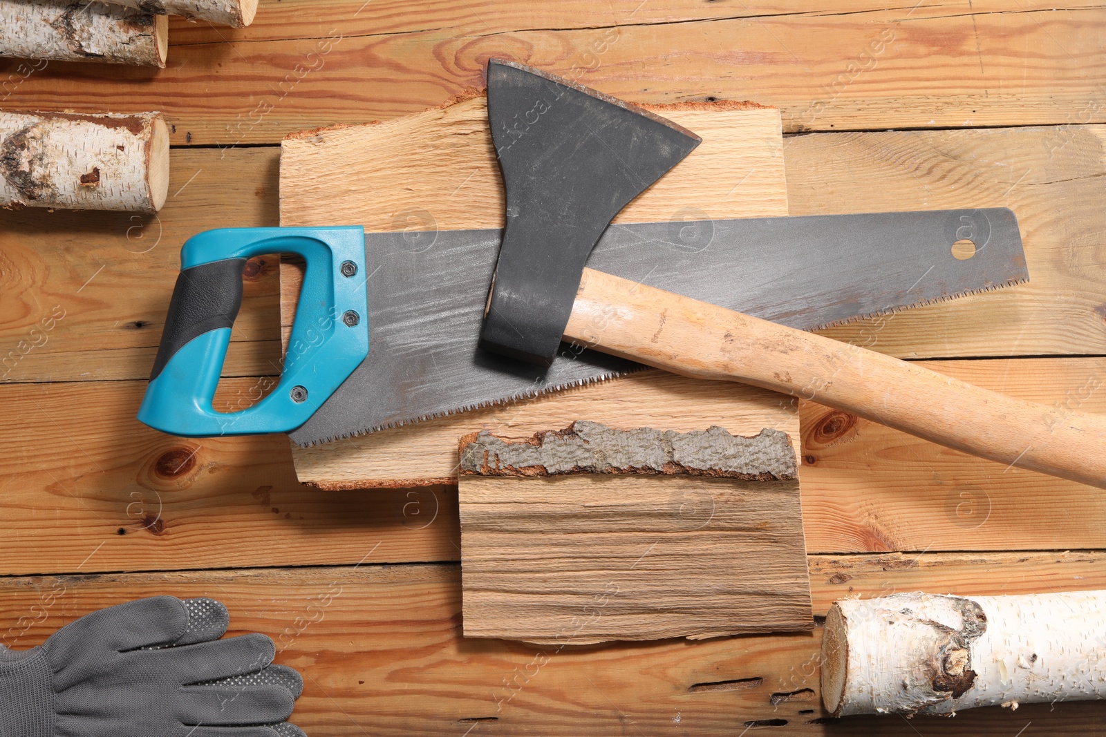 Photo of Flat lay composition with saw on wooden background