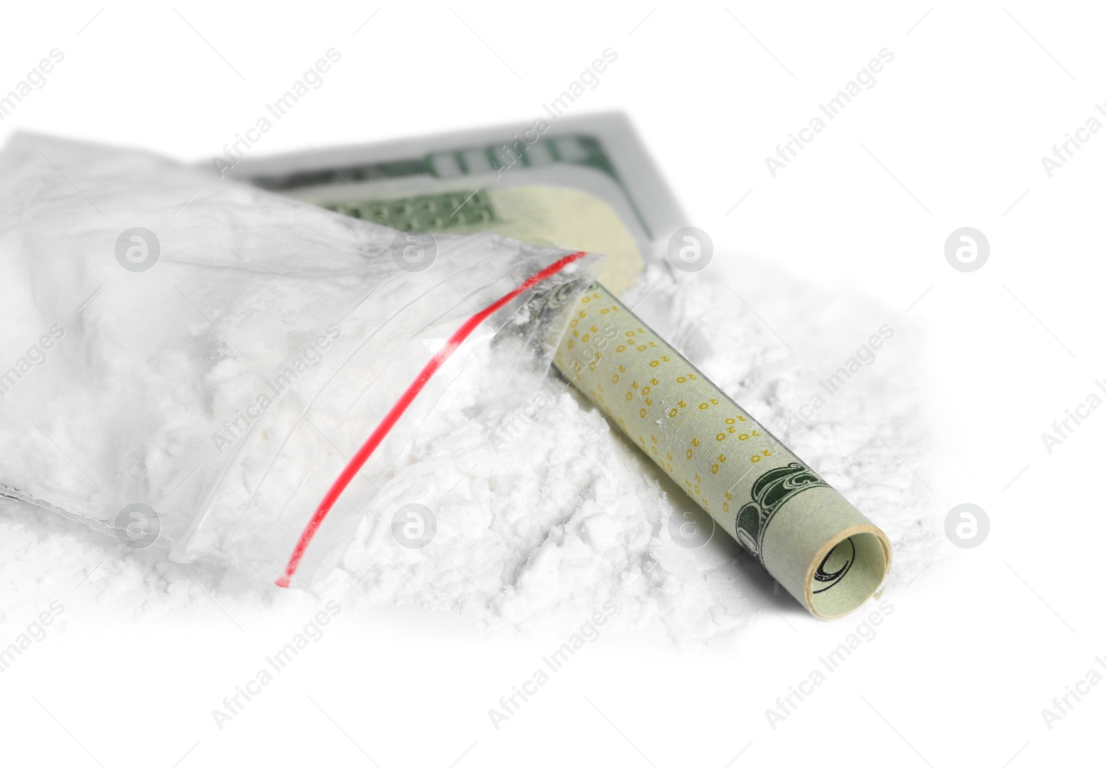 Photo of Cocaine in plastic bag and rolled money bill on white background