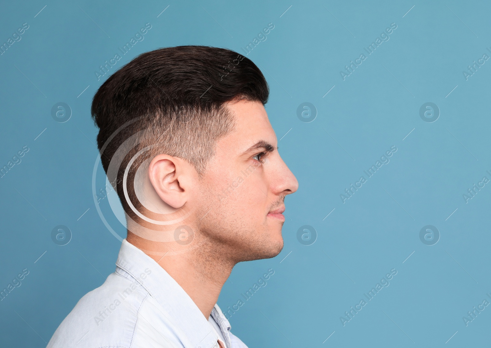 Image of Hearing loss concept. Man and sound waves illustration on light blue background