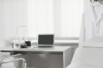 Photo of Doctor's workplace near window in medical office