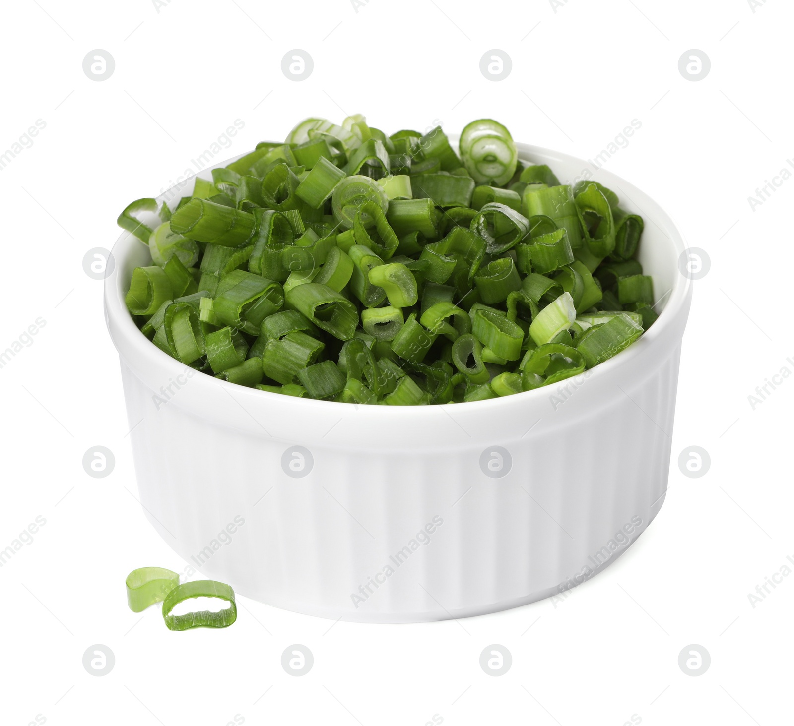 Photo of Chopped fresh green onion in bowl isolated on white