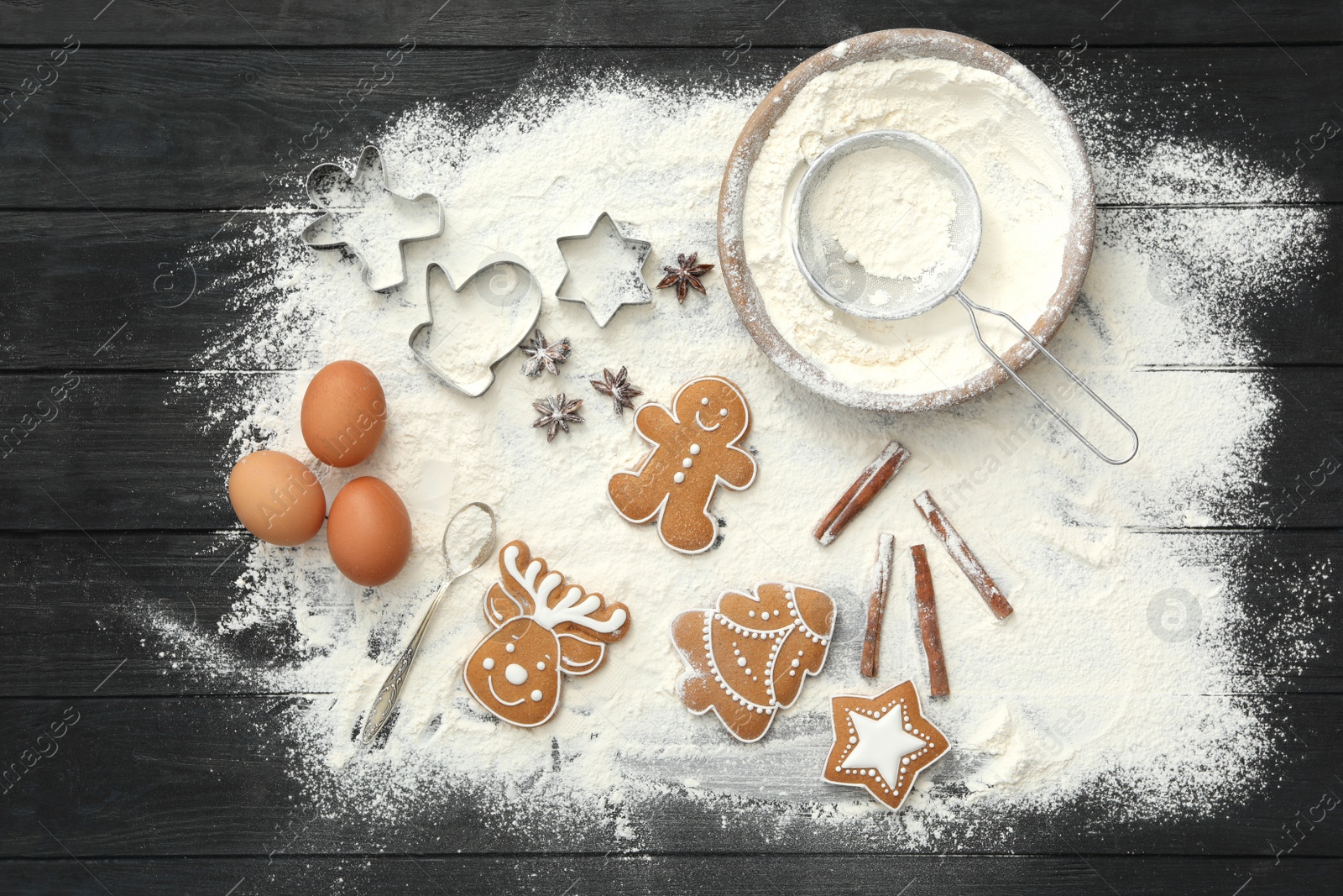 Photo of Flat lay composition with delicious homemade Christmas cookies and flour on table