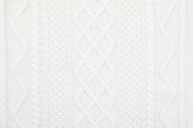 Photo of Texture of cozy warm sweater as background, closeup