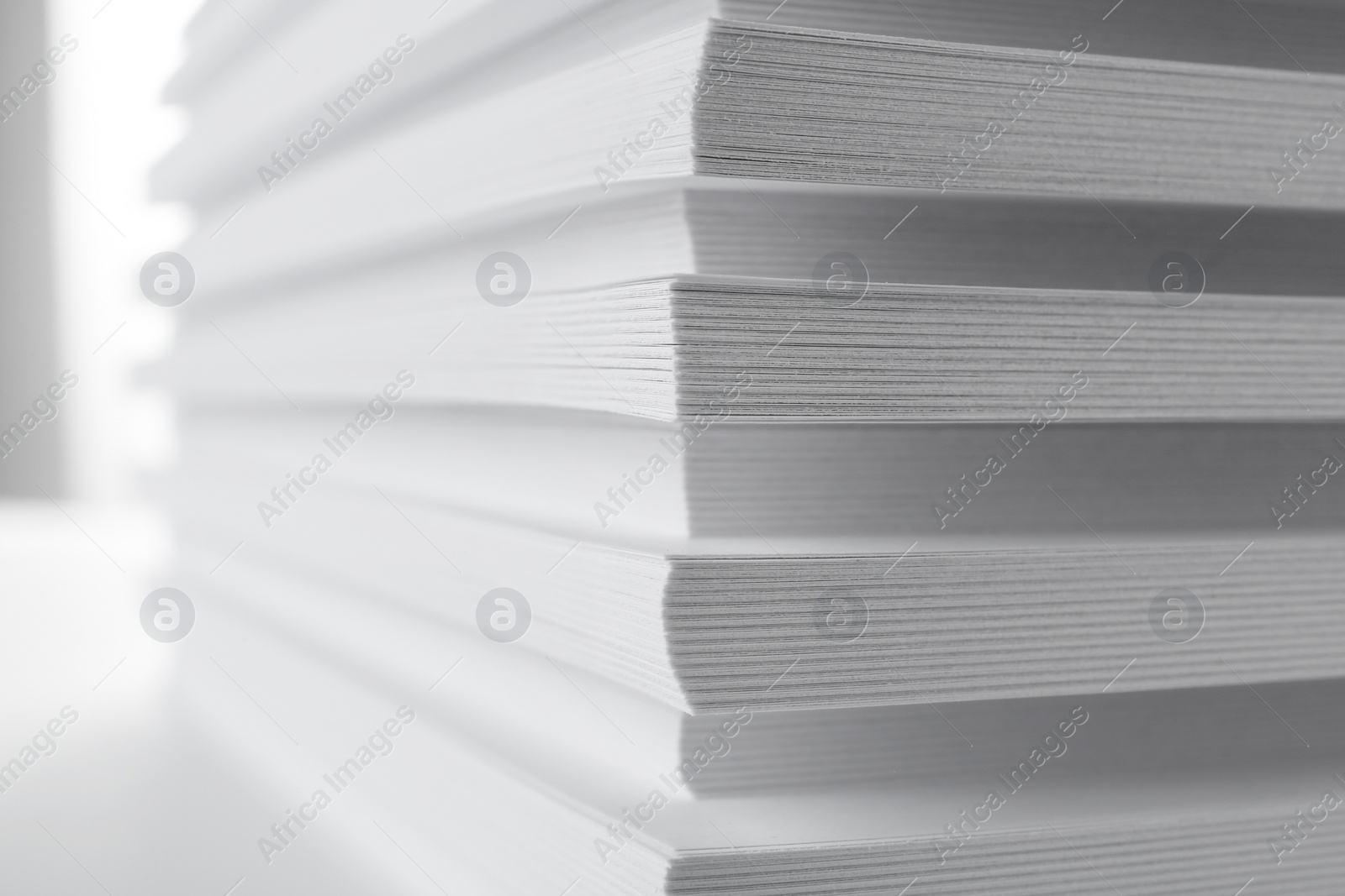 Photo of Stack of blank white paper on table, closeup