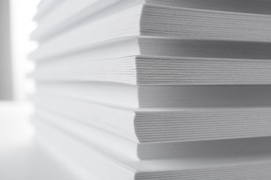 Photo of Stack of blank white paper on table, closeup