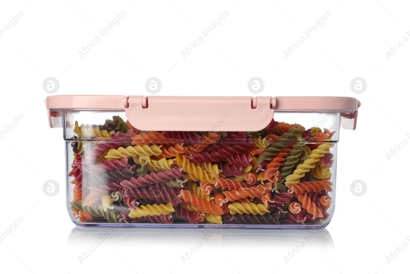 Photo of Box with uncooked pasta on white background