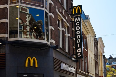 Hague, Netherlands - May 2, 2022: Exterior of Mcdonald's fastfood restaurant on city street