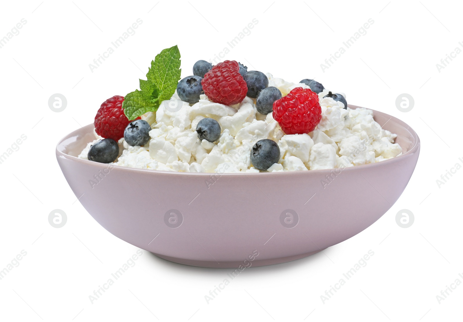 Photo of Fresh cottage cheese with berries and mint in bowl isolated on white