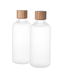 Photo of Bottles of essential oil on white background