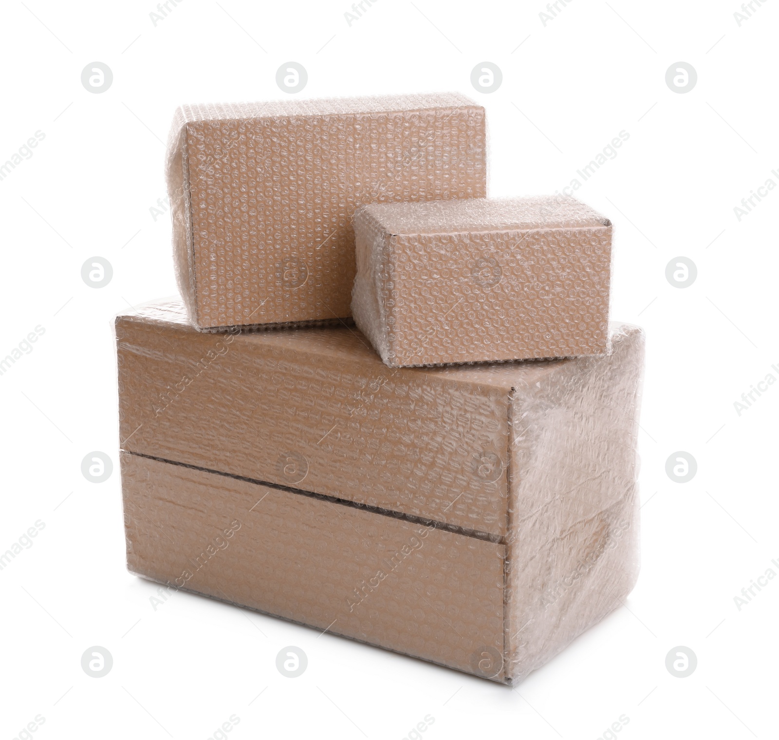 Photo of Cardboard boxes packed in bubble wrap on white background