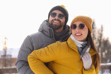 Beautiful happy couple spending time together on winter day