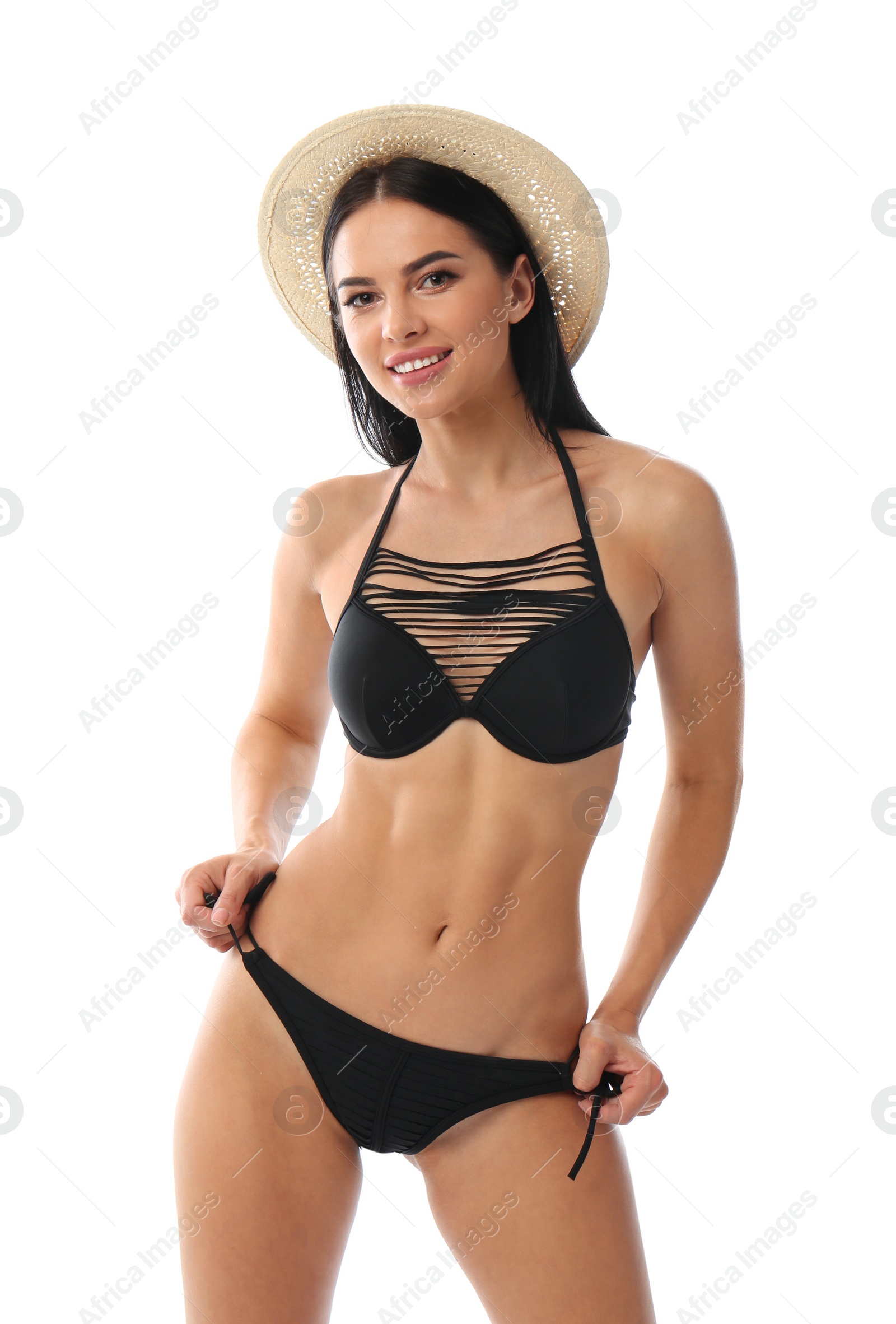 Photo of Beautiful young woman in black bikini with hat on white background