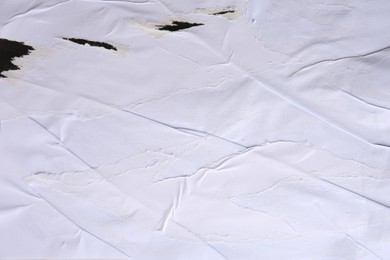 Photo of Texture of ripped paper poster, closeup view