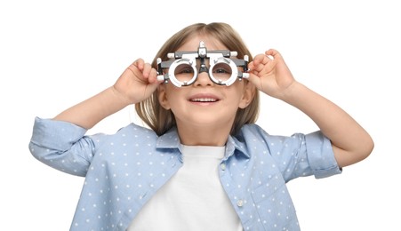 Vision testing. Little girl with trial frame on white background