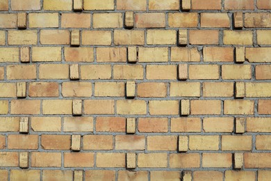 Photo of Texture of orange brick wall as background