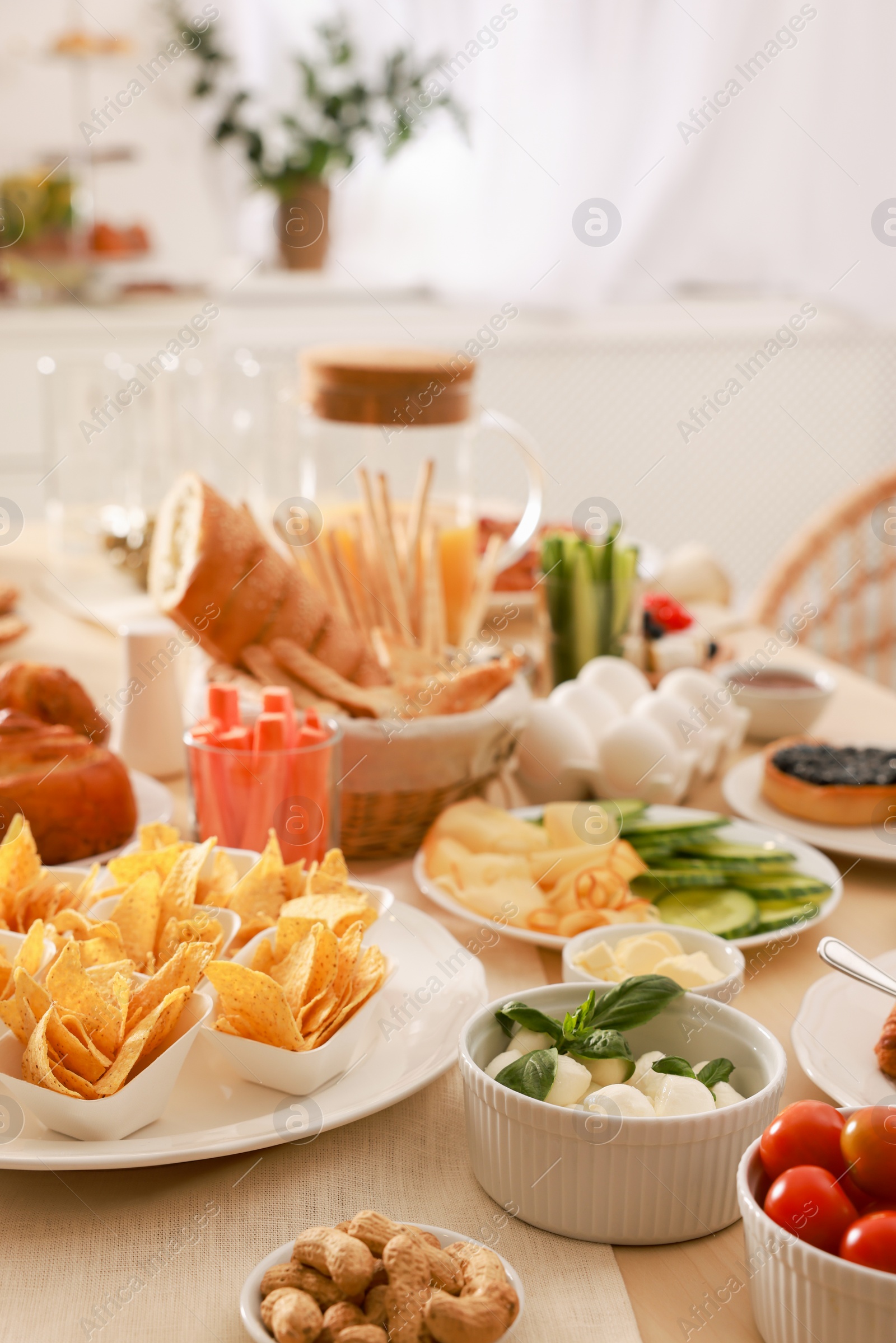 Photo of Dishes with different food on table in room. Luxury brunch