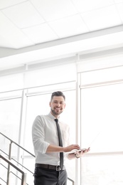 Male lawyer working with laptop in office