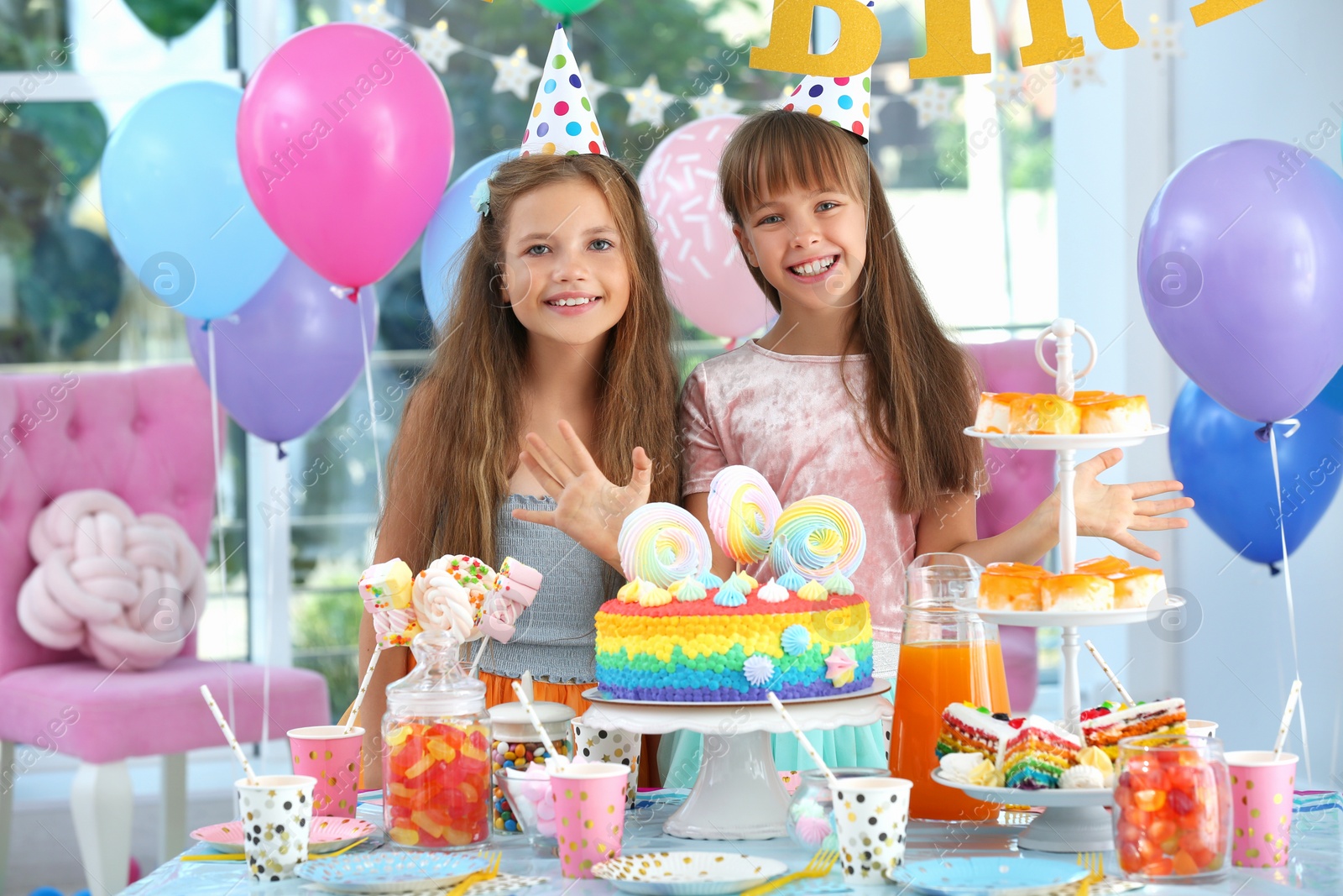 Photo of Happy children at birthday party in decorated room