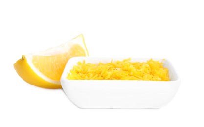 Photo of Grated lemon zest and fresh fruit on white background