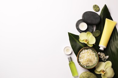 Photo of Flat lay composition with spa stones, sea salt and beautiful flowers on white table. Space for text
