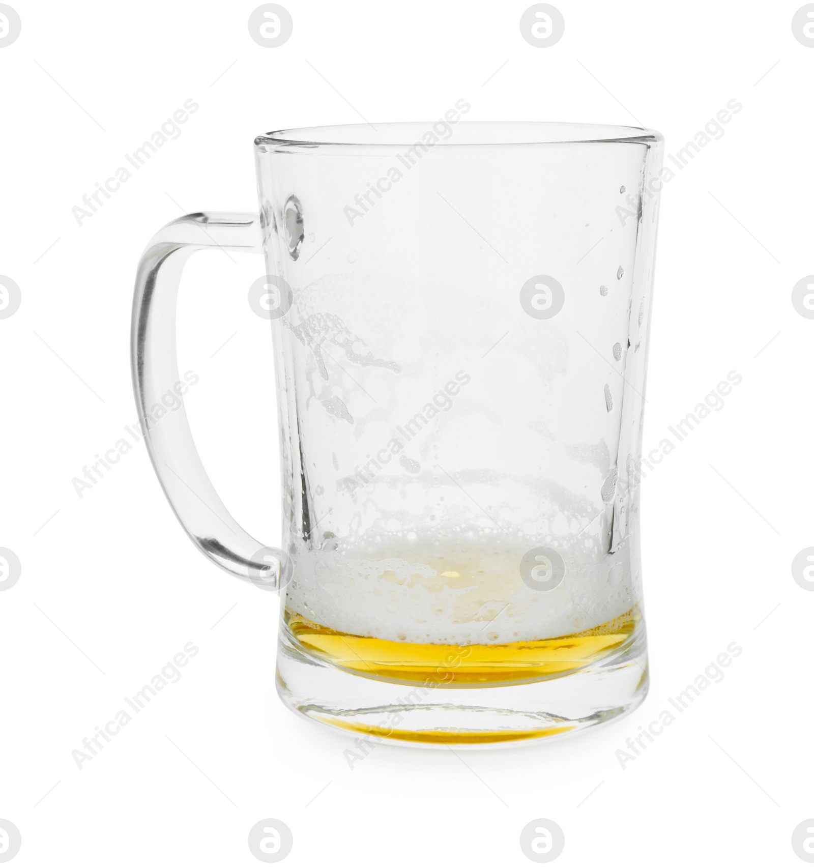 Photo of Almost empty mug of beer isolated on white