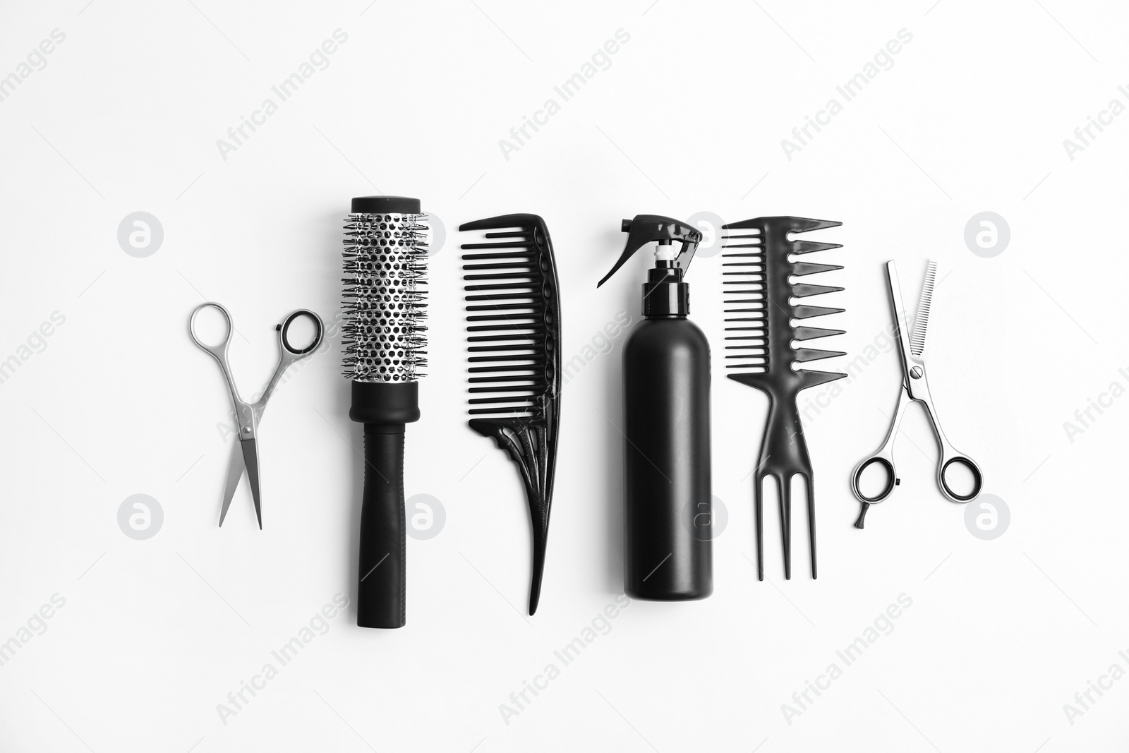 Photo of Professional hairdresser tools on white background