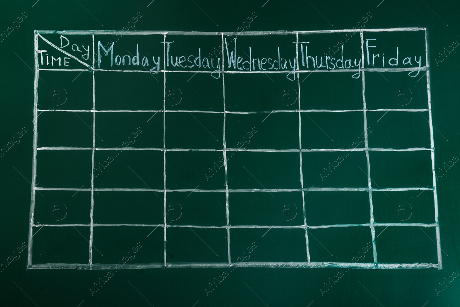 Photo of Weekly school timetable drawn on green chalkboard