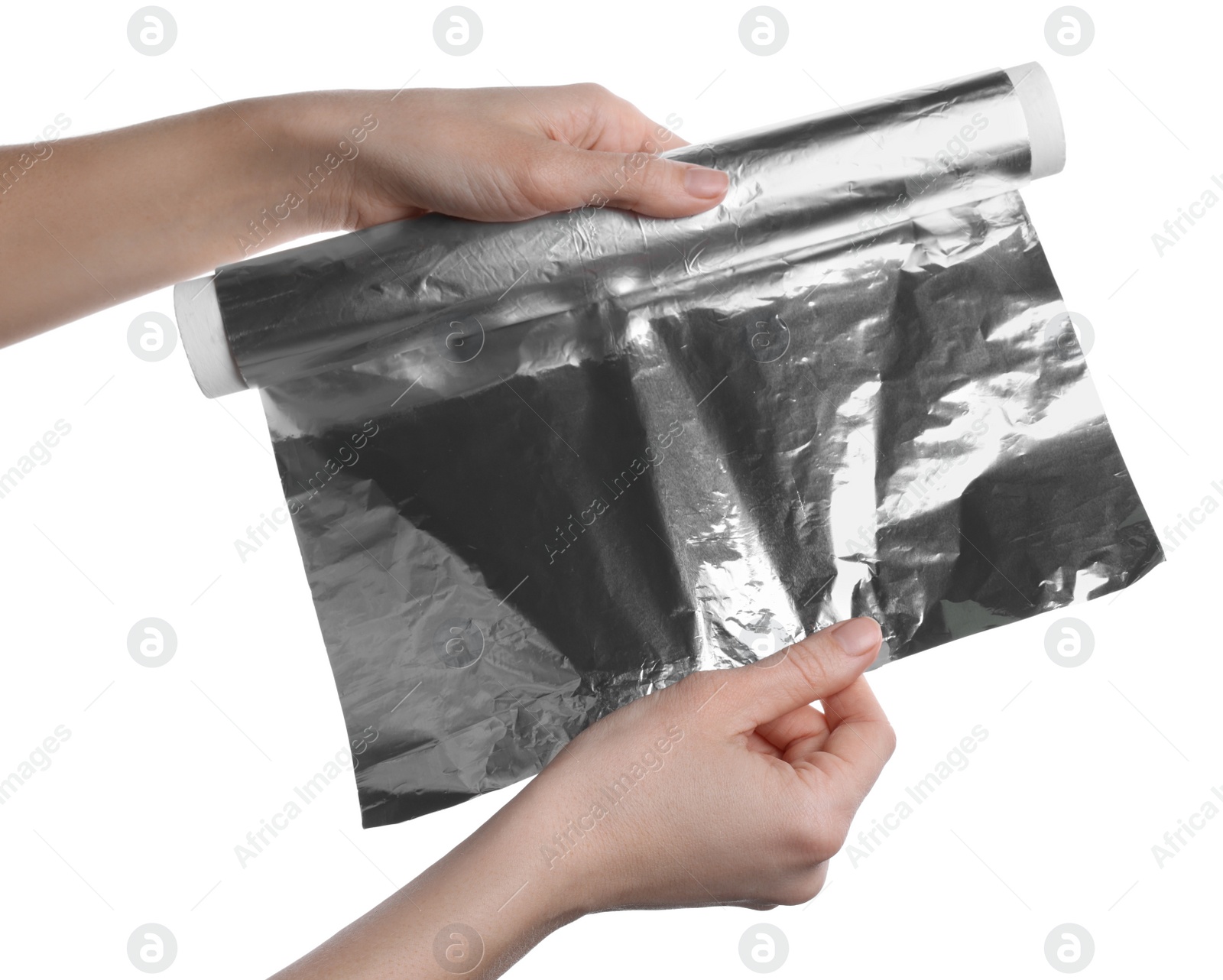 Photo of Woman holding roll of foil paper on white background, closeup