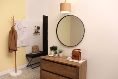 Photo of Modern hallway interior with stylish furniture and mirror
