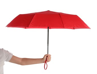 Woman with open red umbrella on white background, closeup